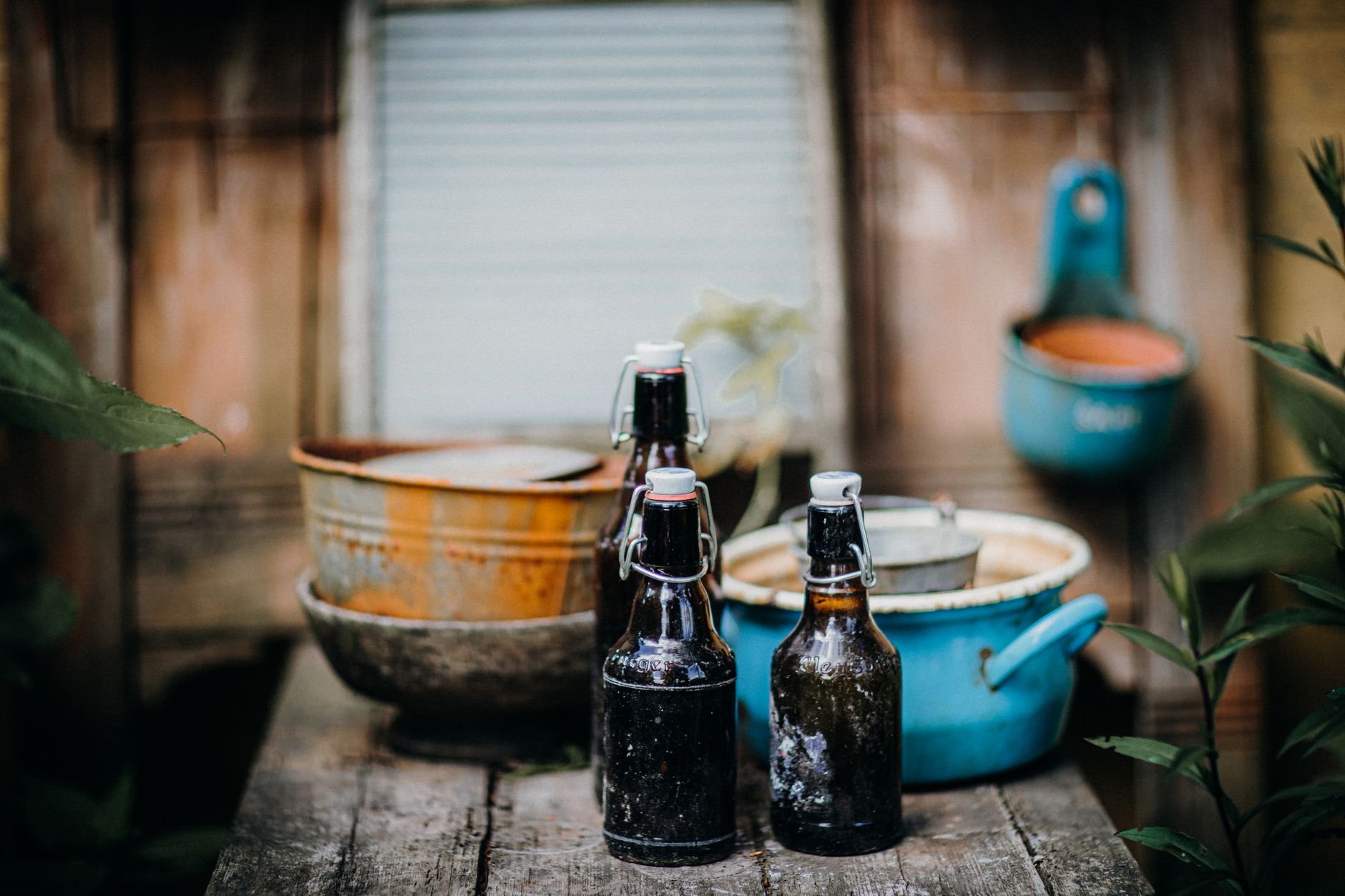 Rustic bottles on a wooden table — evoking the handcrafted, small-batch spirit of Fierro Fire