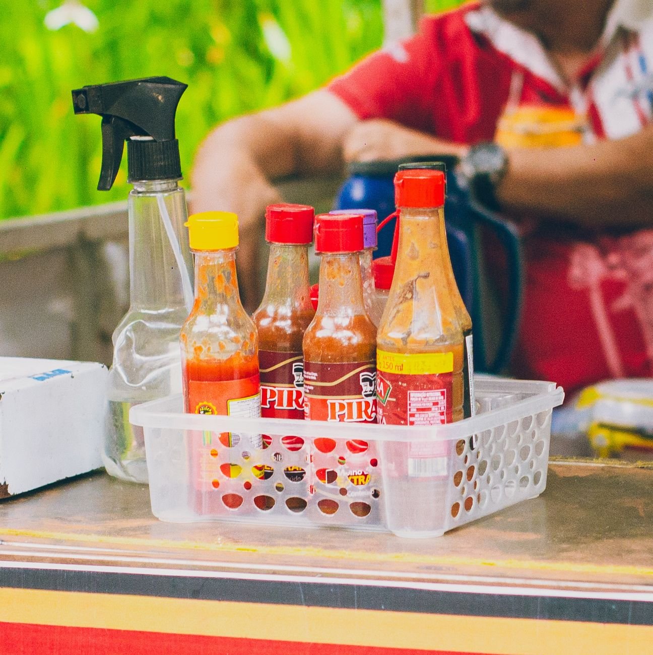Close-up of hot sauce bottles — the kind of small-batch craft bottles Fierro Fire produces